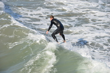 A surfer at Newport Beach, California.