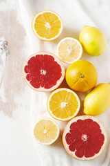 Naklejka na ściany i meble Citrus fruits grapefruit, oranges and lemon on a light background.