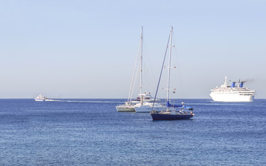 Several boats on the blue clean natural sea for transportation or vacation