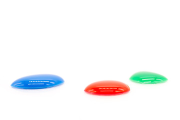 Photos of water droplets of various colors, including red, blue, and green, were dropped on a white background.
