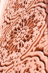 Intricate plaster carvings around an archway in the Medina in Marrakech, Morocco
