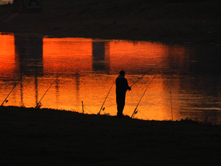 fishing sunset man