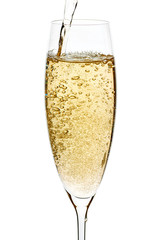 Champagne pouring with bubbles into the glass on white
