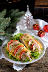 Baked chicken breast with tomato and cheese.