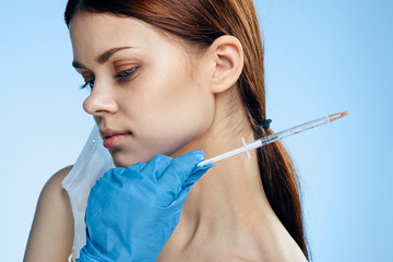 Woman doing cosmetic procedures on a blue background