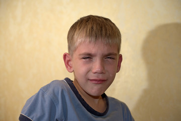 Angry, sad and unhappy baby child. shouting and crying. problem child with head in hands. concept for bullying, depression stres