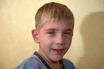 Angry, sad and unhappy baby child. shouting and crying. problem child with head in hands. concept for bullying, depression stres