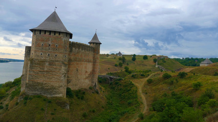 Fototapeta na wymiar Khotyn castle in Ukraine is a powerful medieval fortress that witnessed the fighting between Poles, Cossacks and Turks. High medieval walls, towers on the background of the picturesque Dniester.