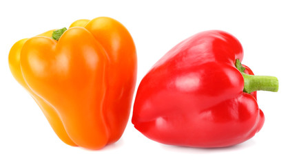two red and yellow sweet bell peppers isolated on white background