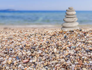 Small beach stone from large to small on beach like symbol of balance