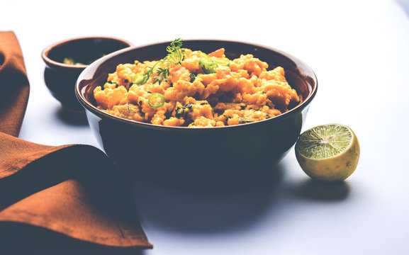 Pithla Bhakar or spicy besan curry or zunka is a popular food recipe made up of Gram flour and jowar flour from Maharashtra India
