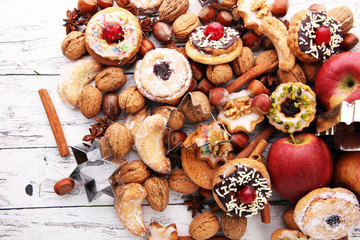 Christmas border. Xmas Gingerbread cookies, spices and decorations on wooden background