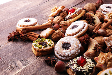 Christmas border. Xmas Gingerbread cookies, spices and decorations on wooden background