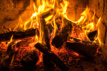 A fire burns in a fireplace, Fire to keep warm