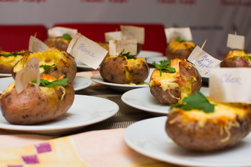 children learn how to cook stuffed potatoes in class