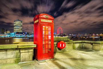 Red phone booth at night in London