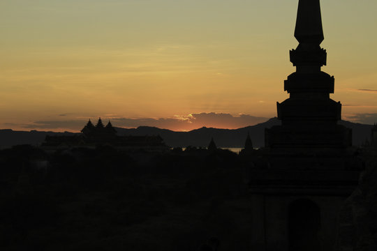 A Silhouette of the Horizon Among the Temples of Bagan at Sunset. These ancient Temples in Bagan, Buma cover a huge area.