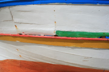 Details of a painted wooden boat with many colors