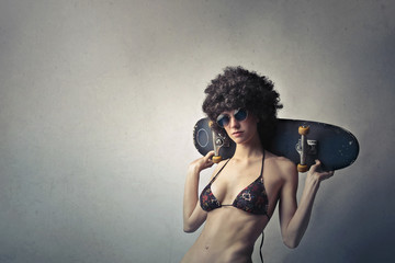 Fashionable girl with skateboard