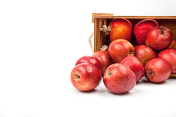 Wooden box with apples isolated on white background