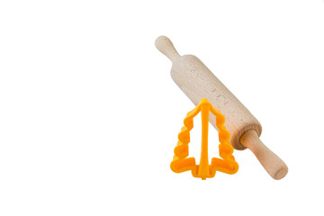 Rolling pin for dough and  forms for the test, a white background. Isolated.