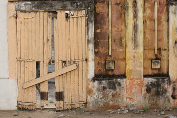 an old closed wooden gate in grand bassam in ivory coast