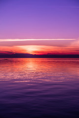 Obraz premium After Sunset Colors by the Sea, Purple tones, Vertical shot