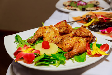 Fried chicken with hot sauce and wine on wooden table