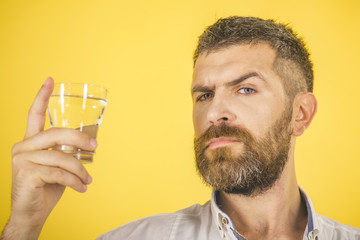 Fototapeta premium man with beard on serious face drink water from glass