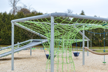 Fototapeta premium Modern children playground in park in Canada
