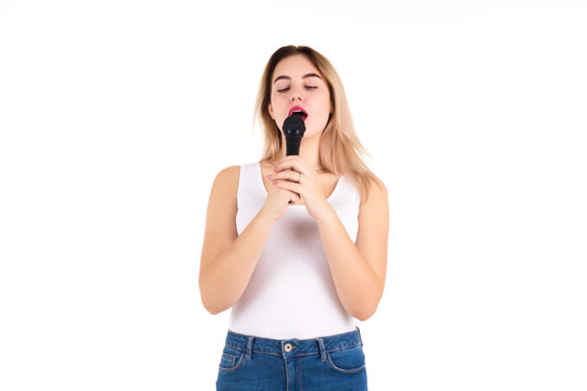 Young cute girl with microphone, isolated  
