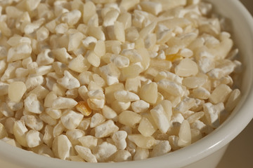 A bowl of dried white hominy, corn, called  maiz trillado or Morocho Partido in Spanish