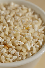 A bowl of dried white hominy, corn, called  maiz trillado or Morocho Partido in Spanish