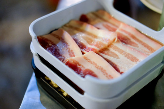 Bacon streaky on white tray