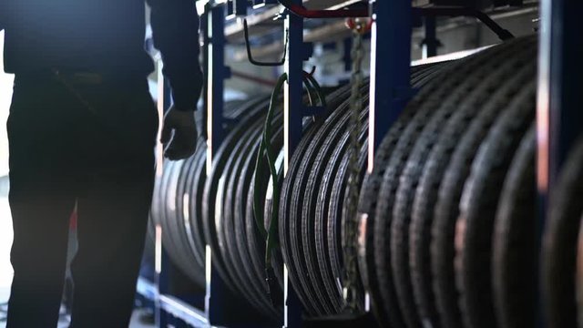 Worker choosing a tire in the warehouse