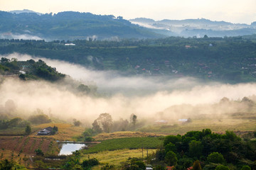 Fog in forest with morning sunrise at Khao Takhian Ngo View Point at Khao-kho Phetchabun,Thailand