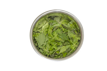 basil leaf in stainless bowl