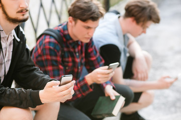 teenager social network addiction. modern youth online lifestyle. students browse internet for...