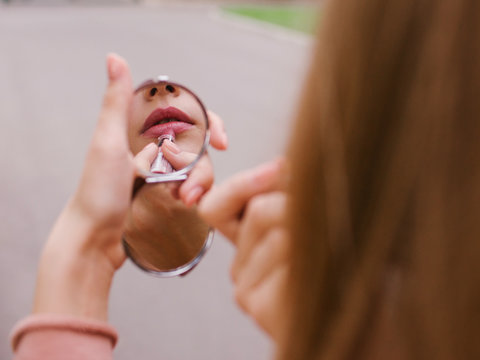 Woman Putting Lipstick On. Seductive Plump Lips. Preparing To Meet Boyfriend. Perfect Makeup Concept