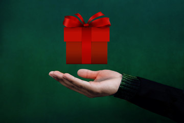 Christmas and New Year Concept, Hand opened to Present a Red Gift Box, Float like a Magic
