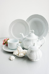Porcelain tea set on white background. Luxury exquisite and expensive crockery concept