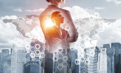 Concept of business success and control with confident boss against cityscape background