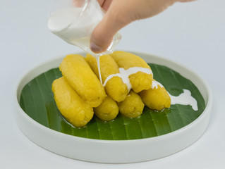 Preserved banana in syrup, Thai style, served on a white background.