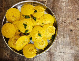 Healthy Indian breakfast Dhokla in a plate on the table