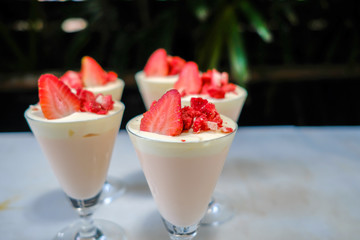Dessert strawberries and cream.   (selective focus)
