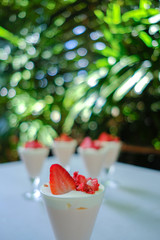 Dessert strawberries and cream.   (selective focus)
