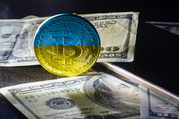 Bitcoin close up on keyboard background the flag of ukraine is shown on bitcoin