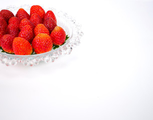 fresh strawberries on a glass plate
