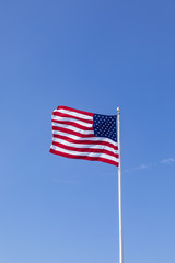 stars and stripes under  blue sky