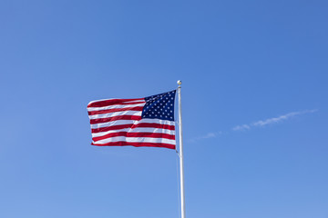 stars and stripes under  blue sky